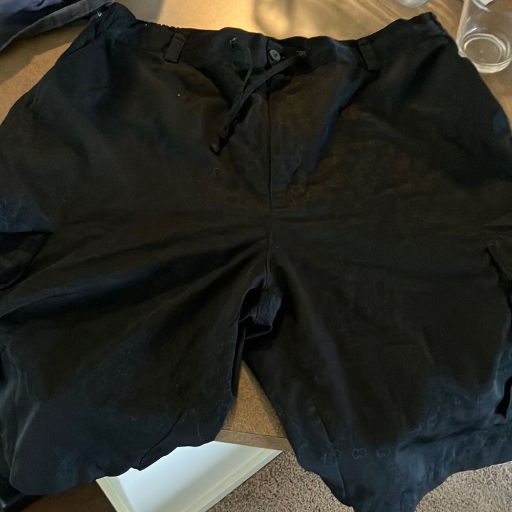 Men’s black Stnergy swim trunks. Button and zipper with drawstring